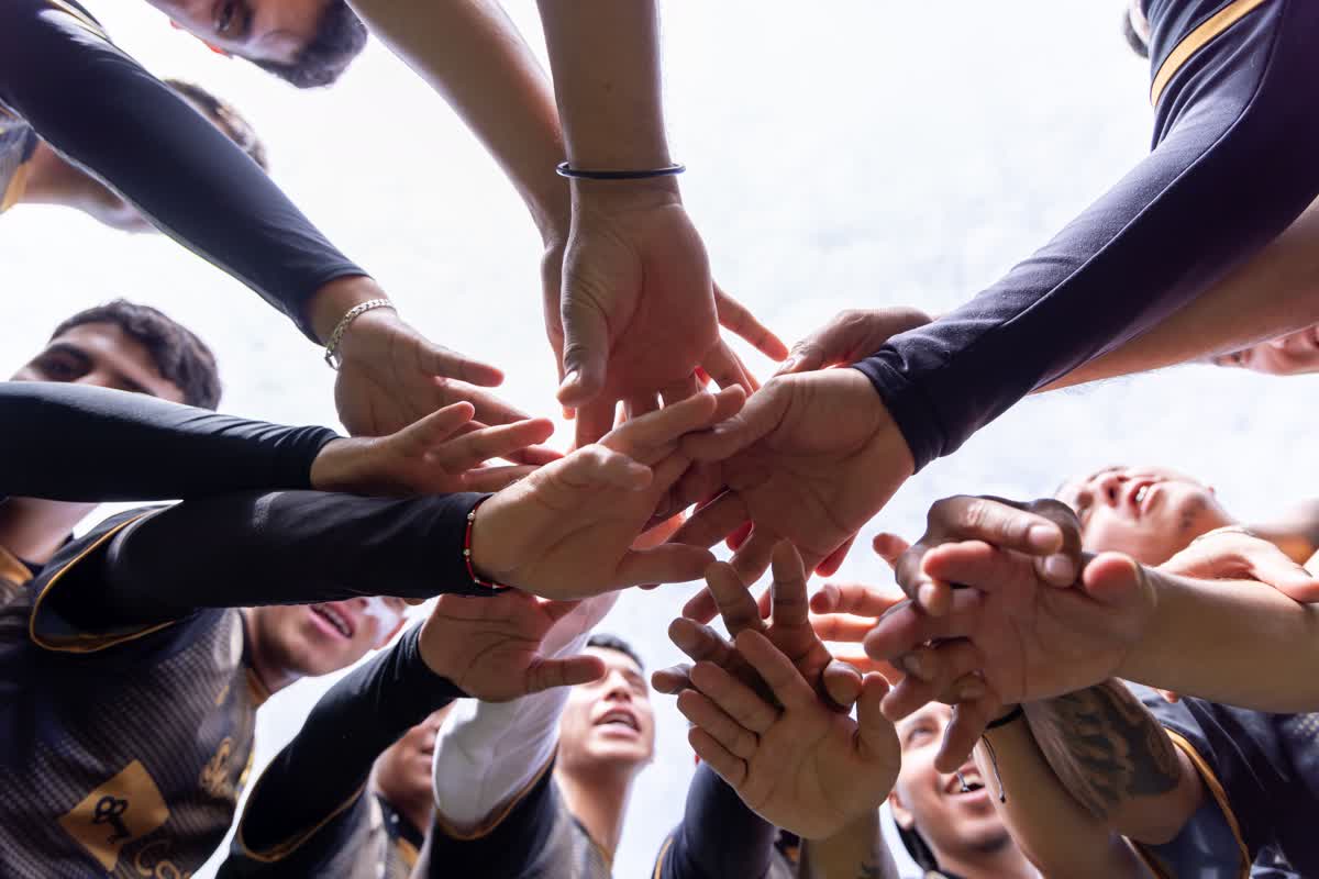 Team hands in together